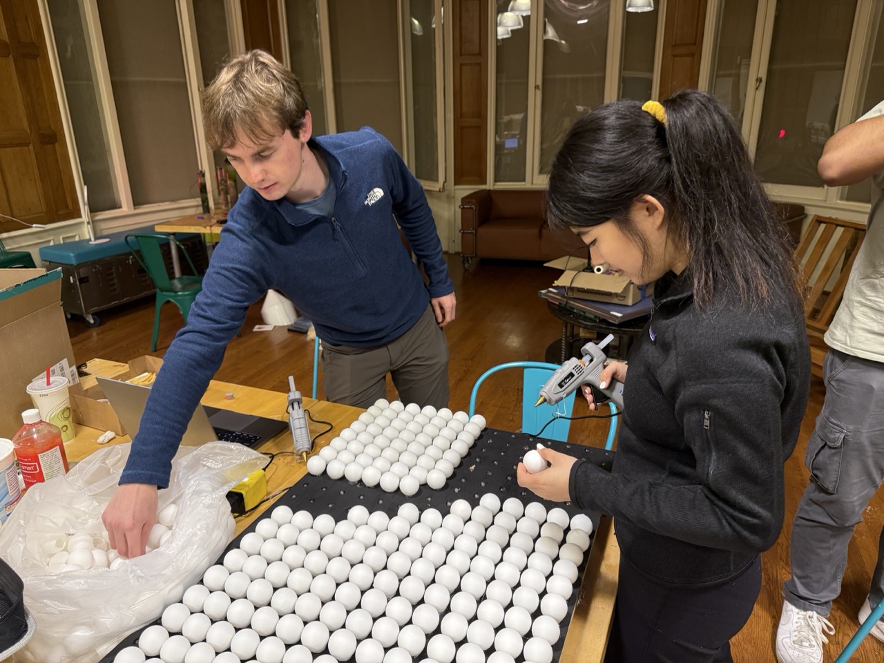 Gluing the ping pong balls on