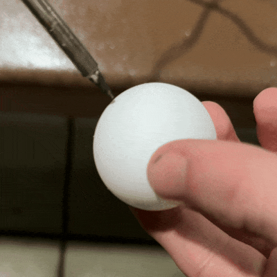 Melting the hole in the ping pong ball.